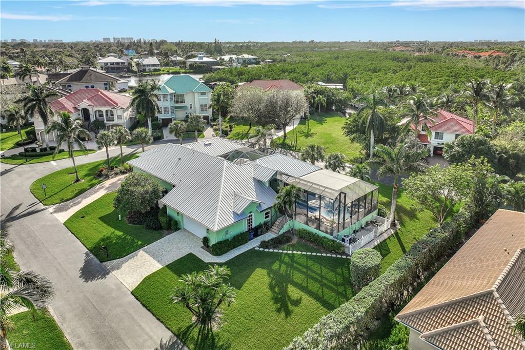 an aerial view of residential houses with outdoor space and river