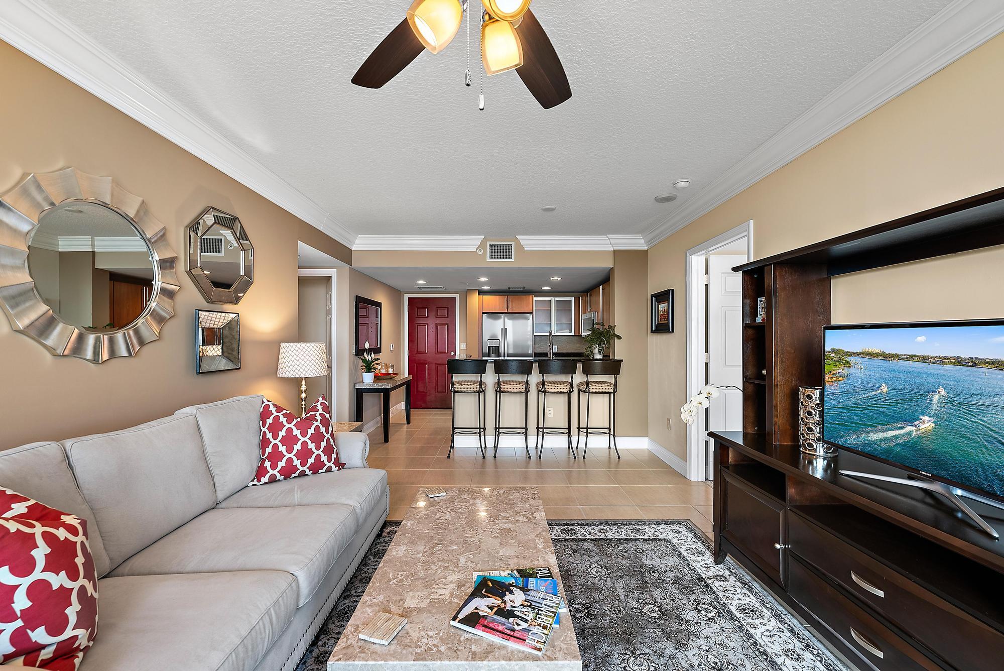 a living room with furniture and a flat screen tv