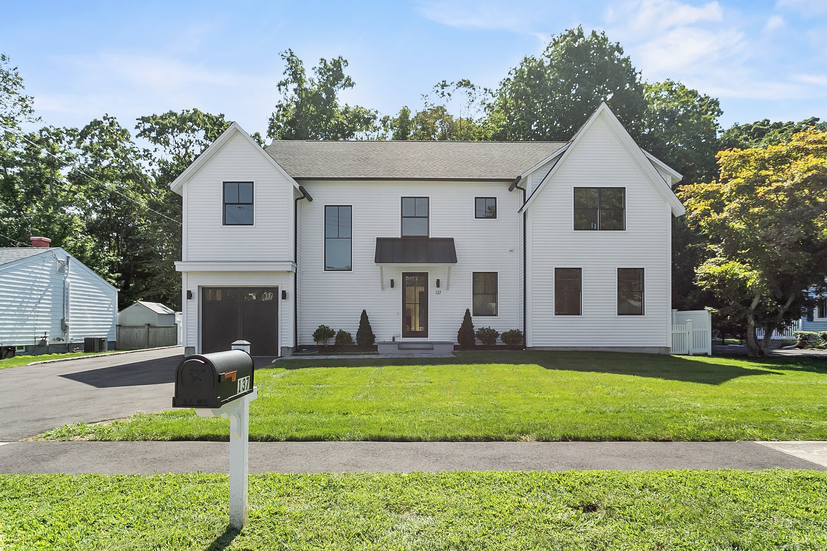 front view of a house with a yard