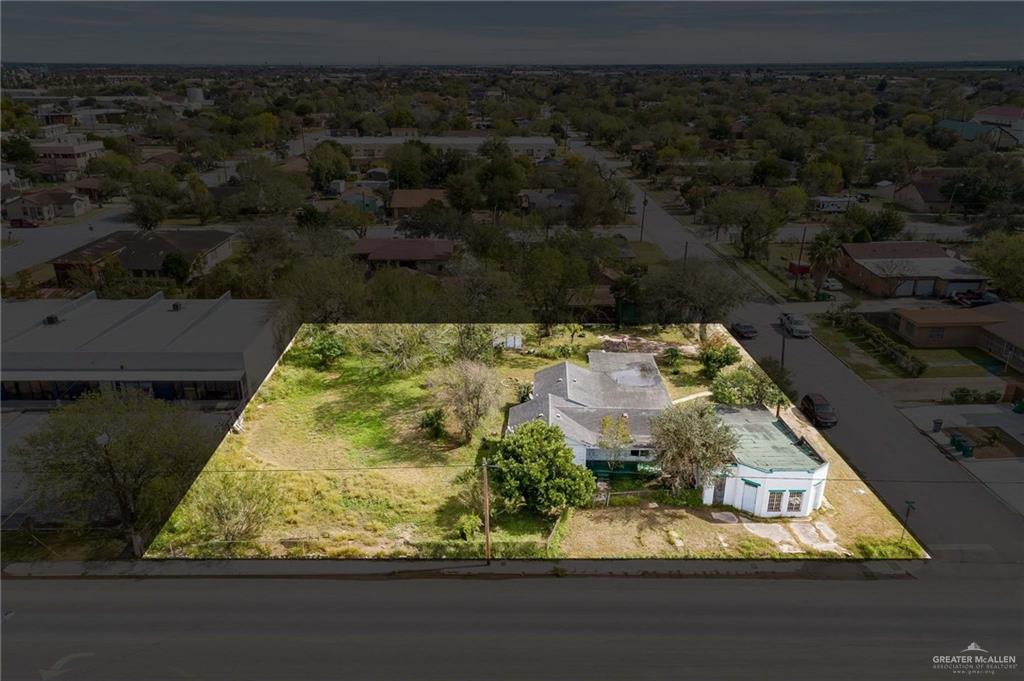 an aerial view of a residential houses with outdoor space