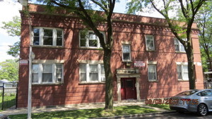 front view of a building with a yard