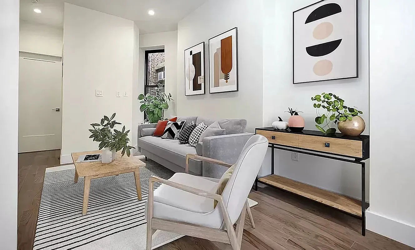 a living room with furniture and flowers