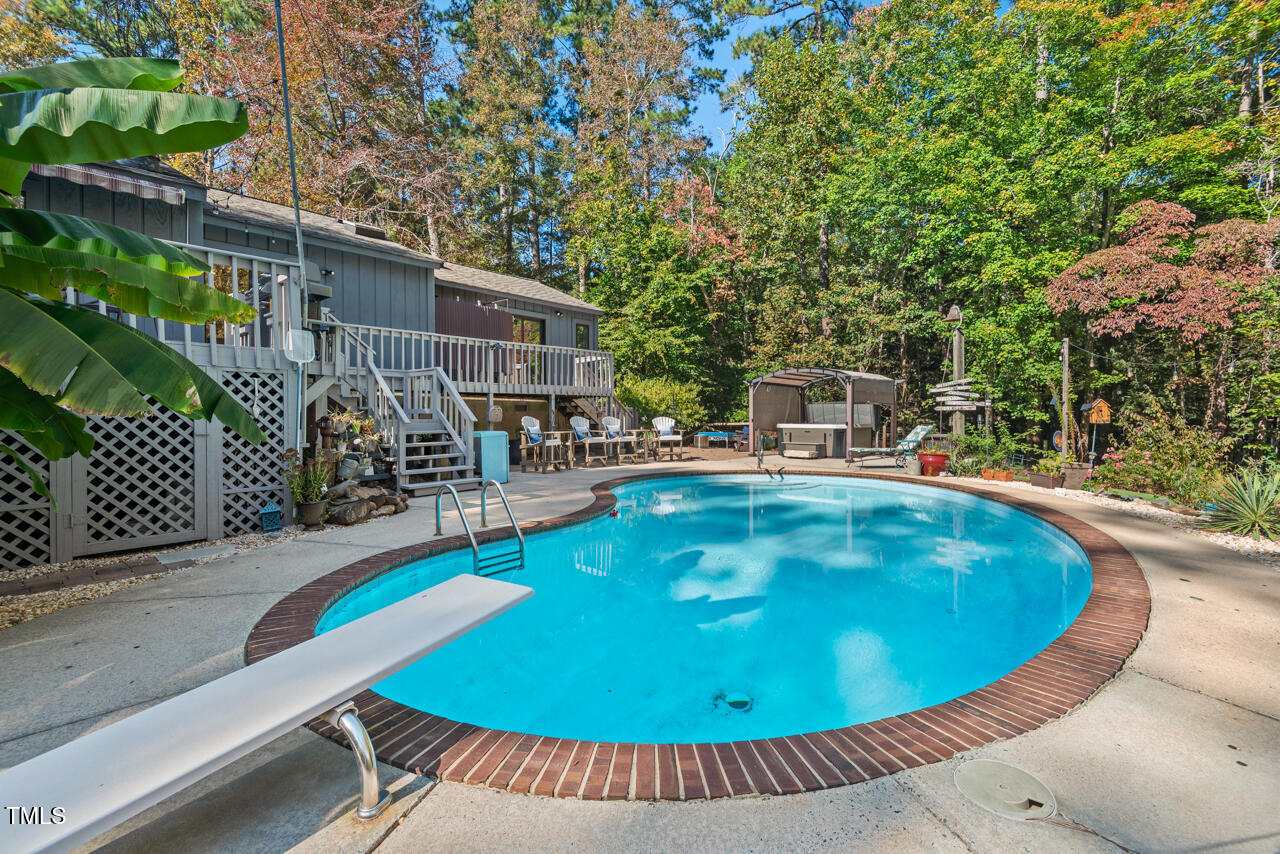 a view of a swimming pool with a patio