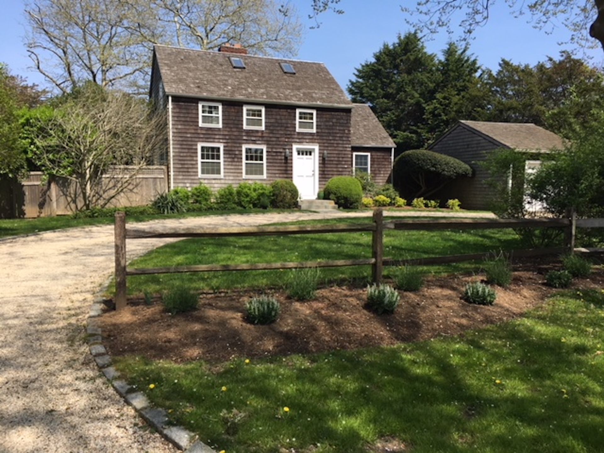 a front view of a house with garden