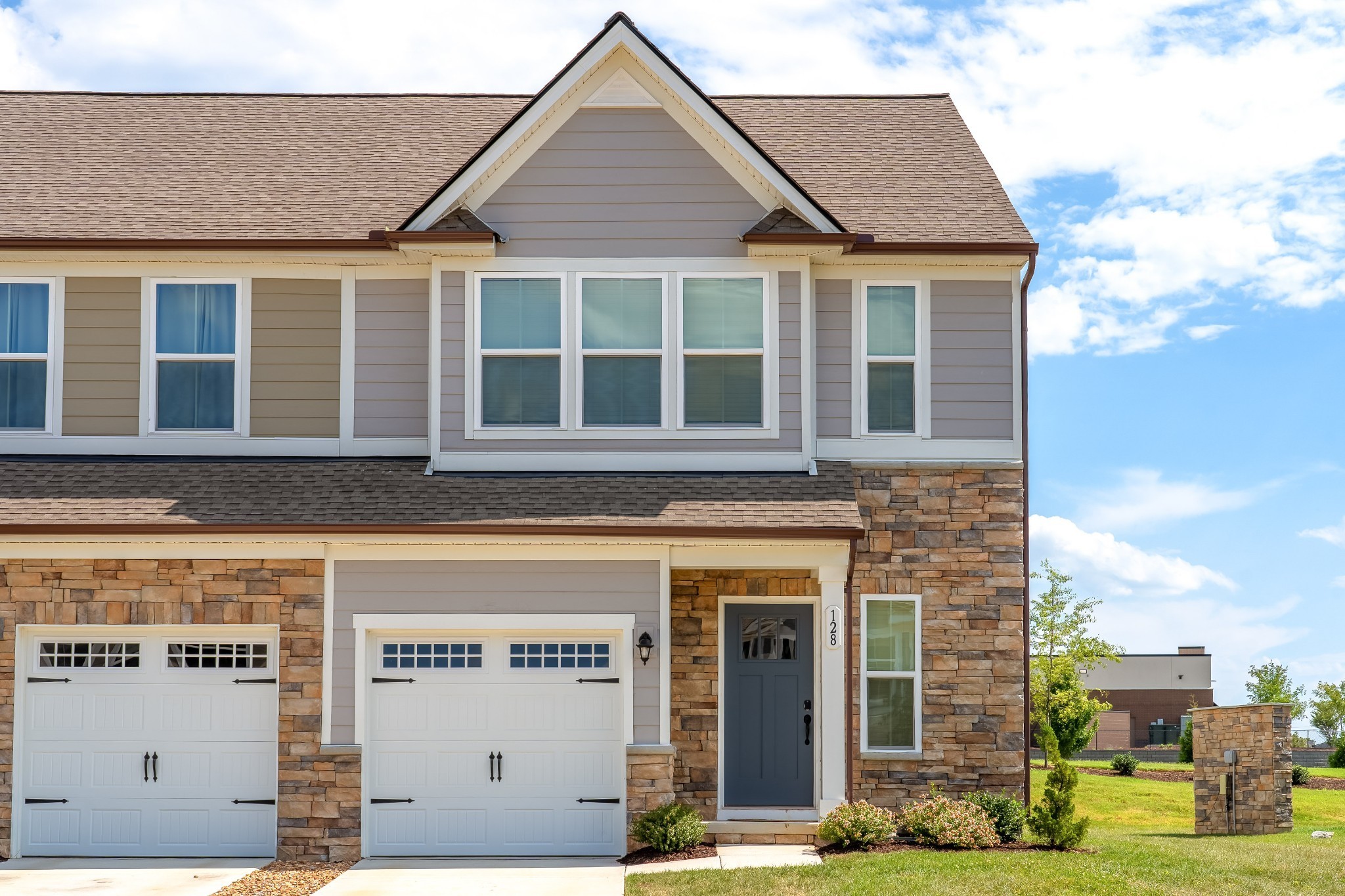 a front view of a house with a yard