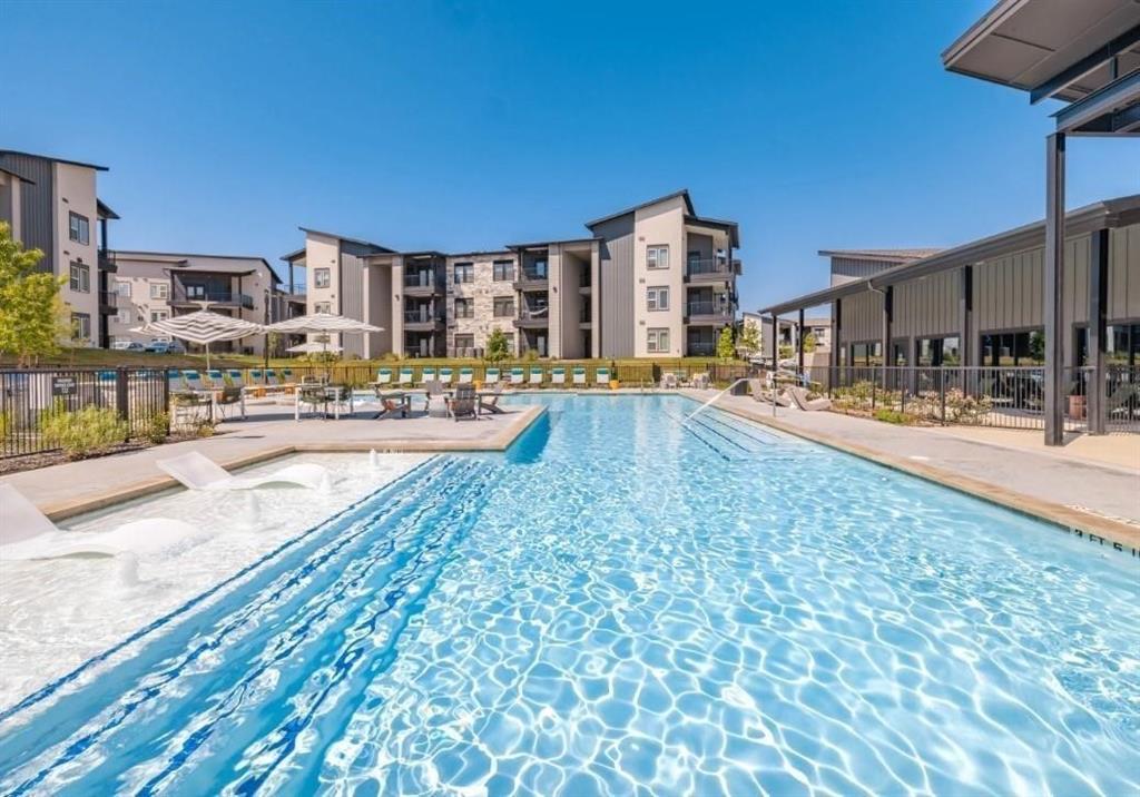 a view of a swimming pool with an outdoor seating