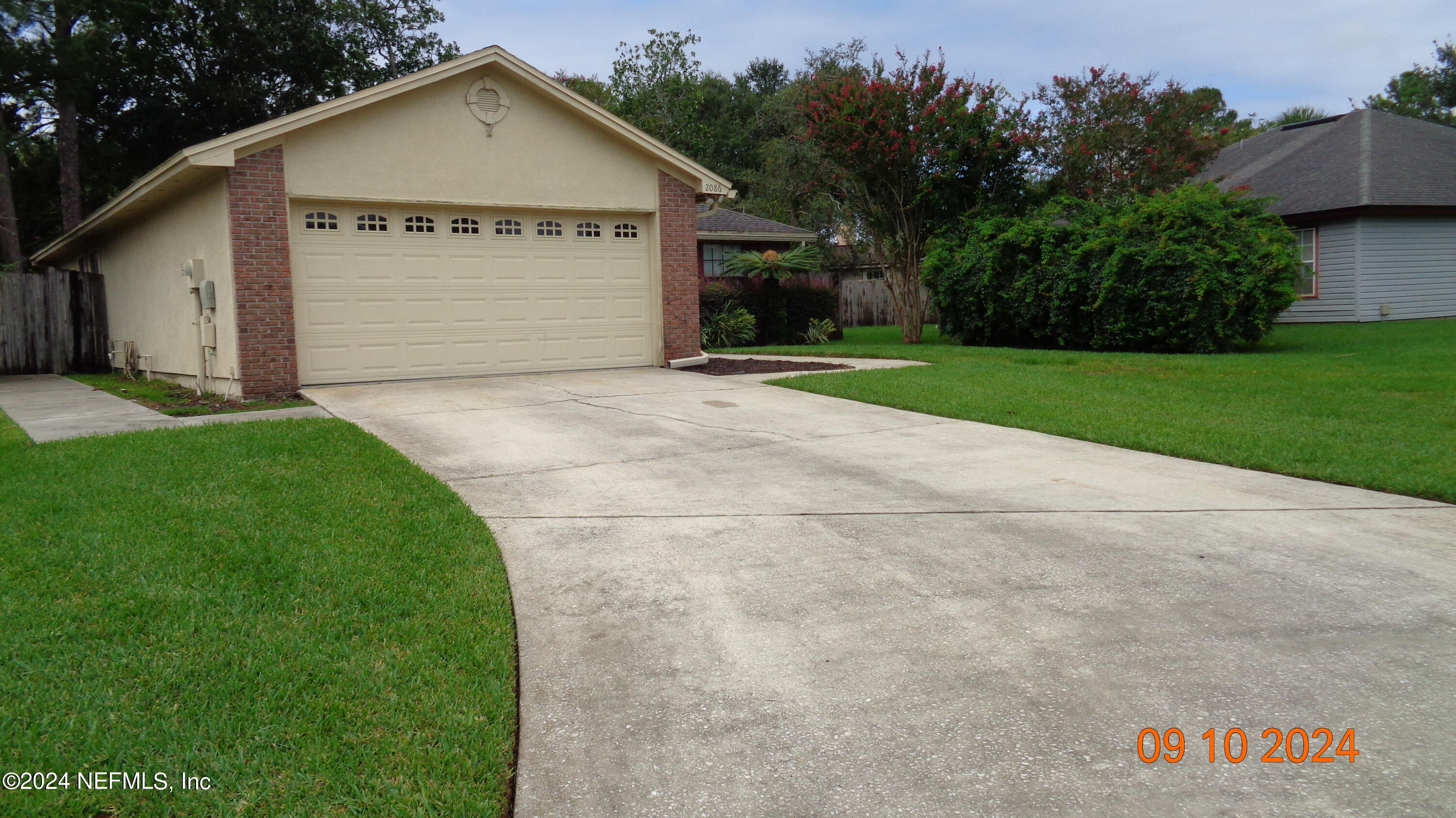 a view of backyard of house with garage