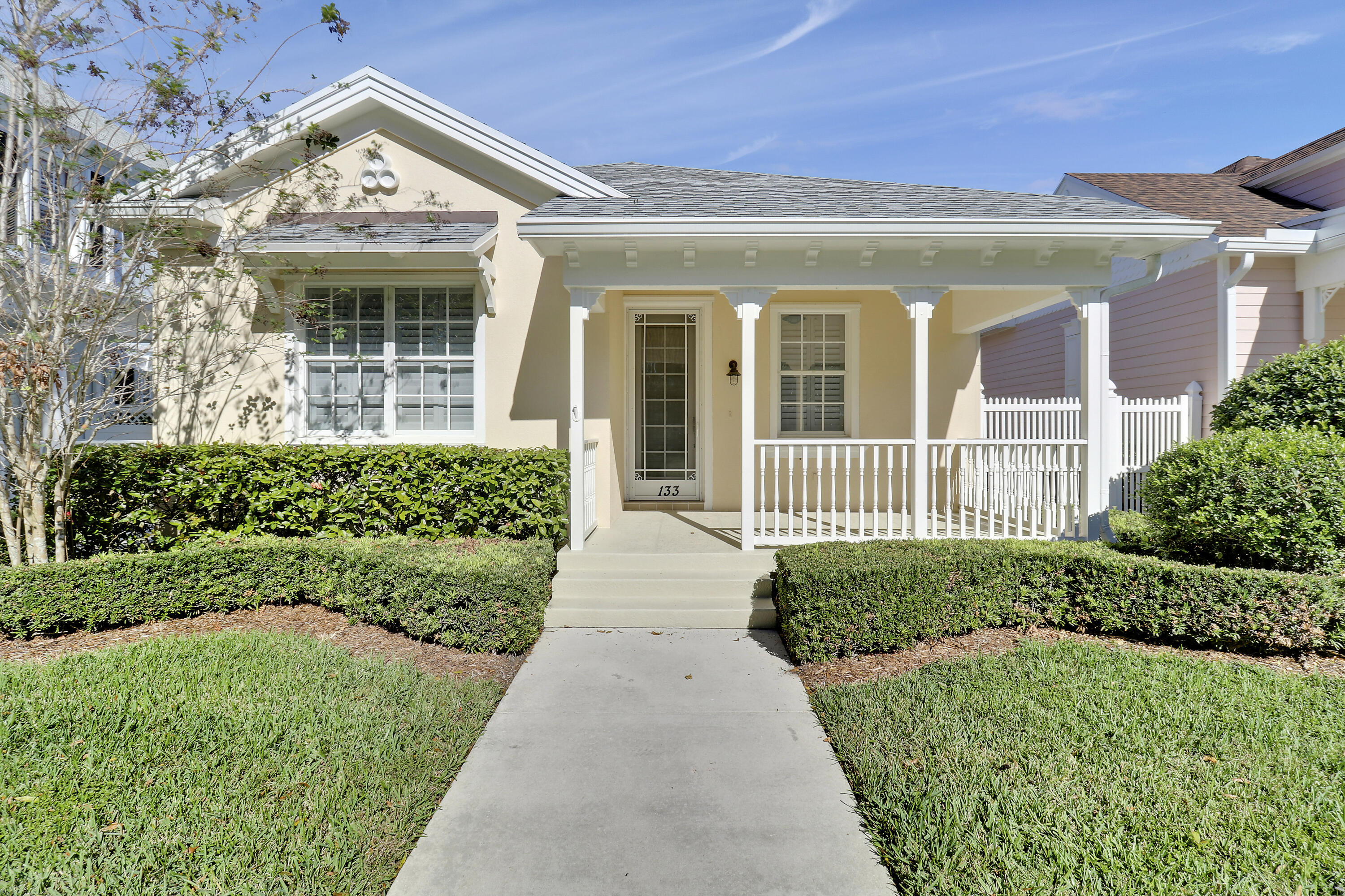 front view of a house with a yard