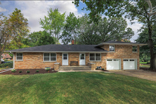 front view of a house with a yard