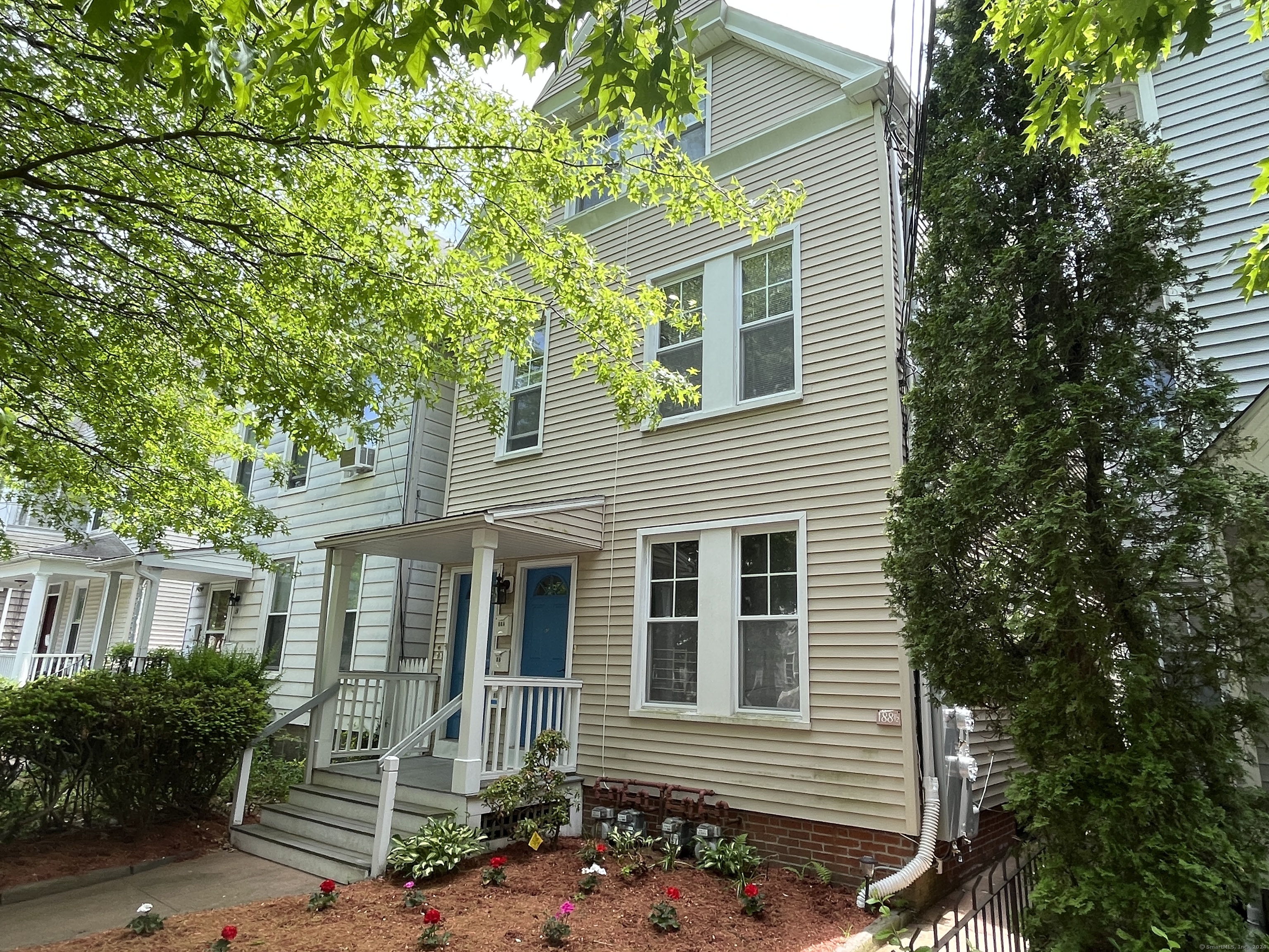 a front view of a house with garden