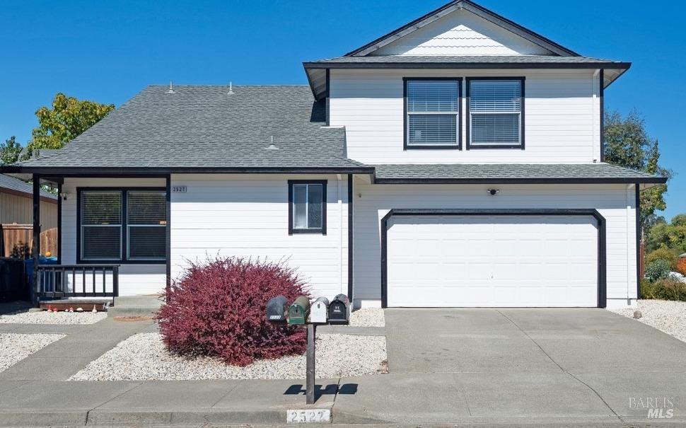 a front view of a house with garage