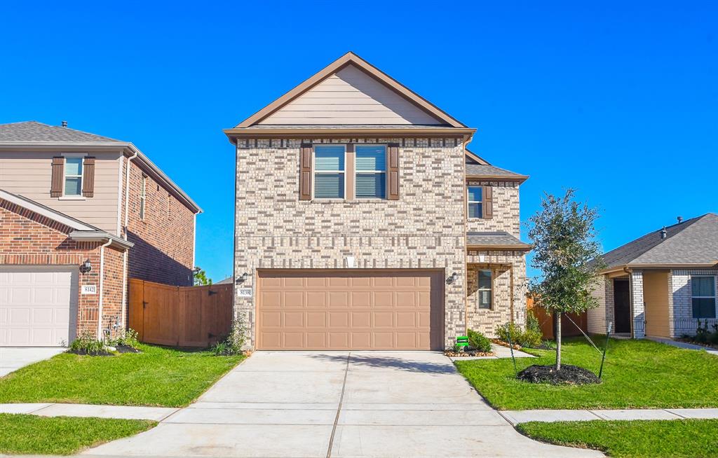 a front view of a house with yard