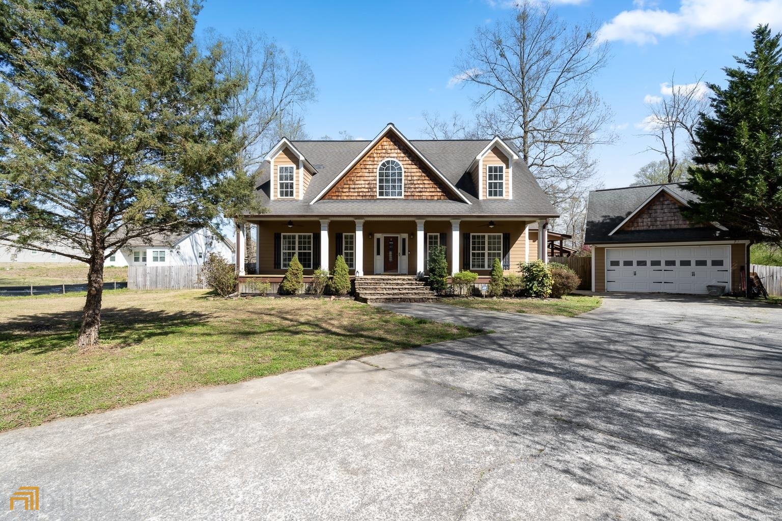 a front view of a house with garden