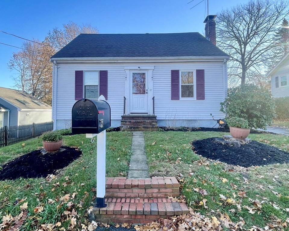 a front view of house with a yard