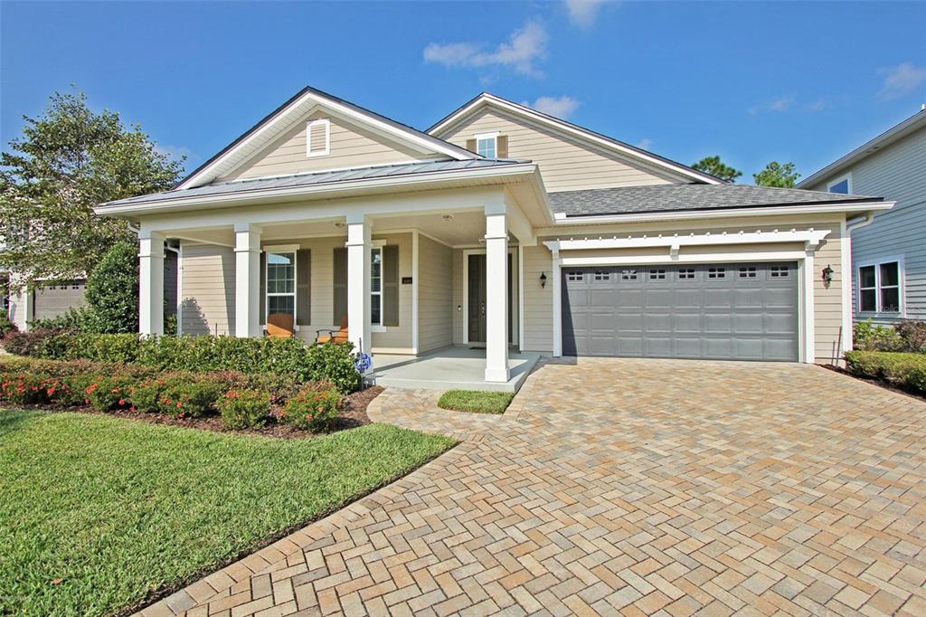 front view of a house with a garden