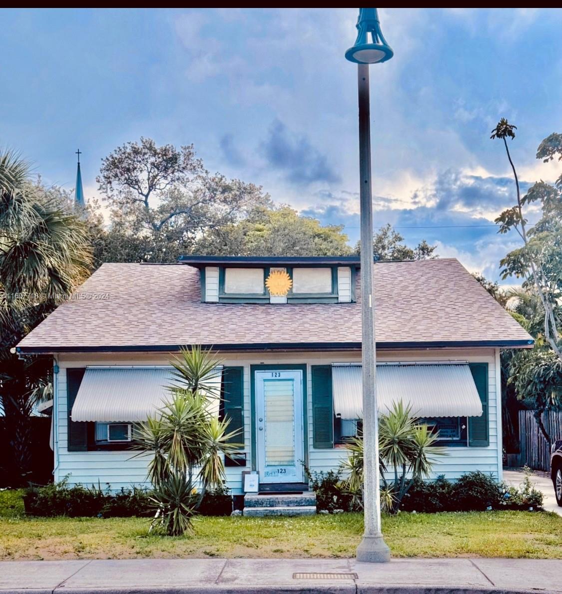 a front view of a house with garden