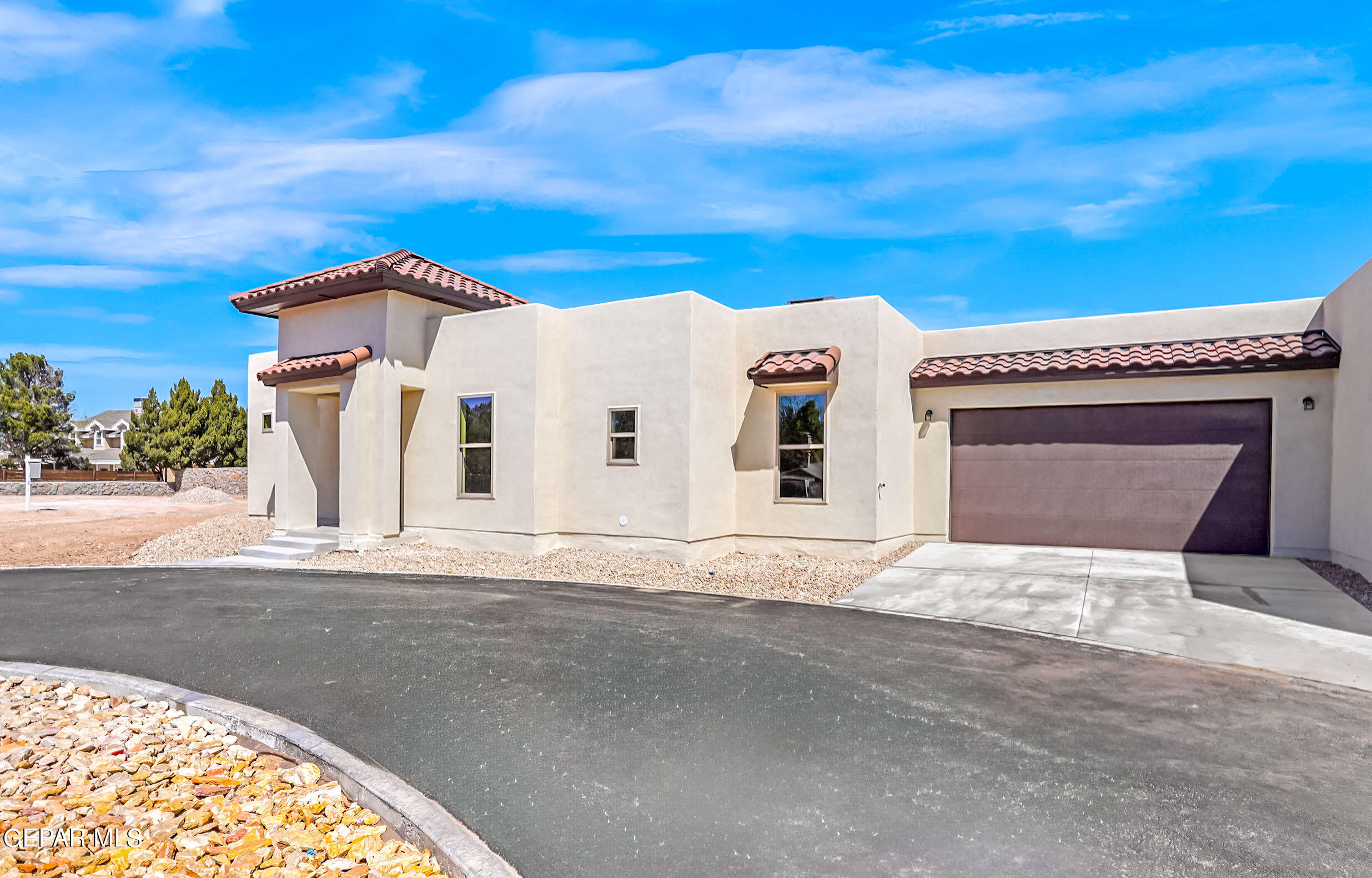 a front view of a house with a garage