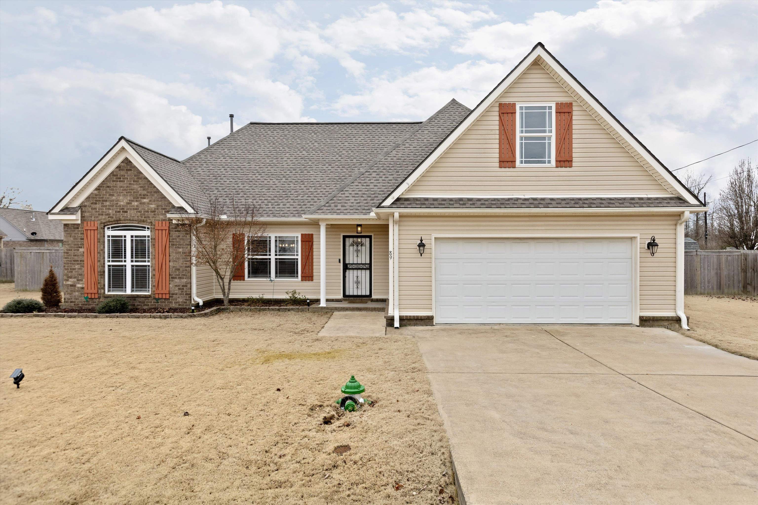 front view of a house with a yard