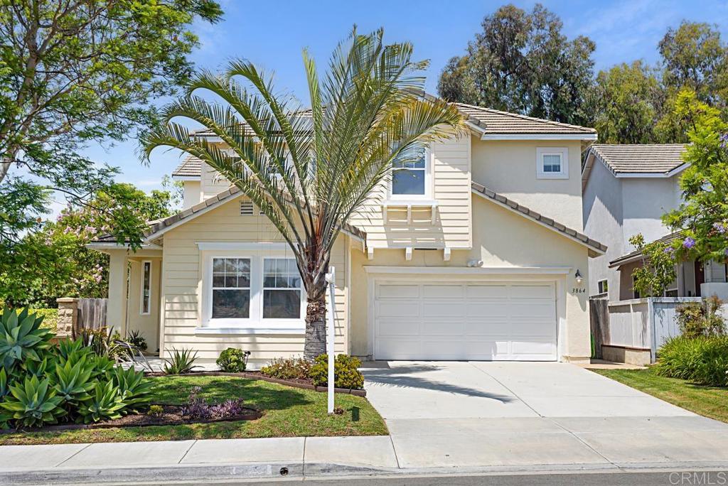 a house that has a tree in front of it