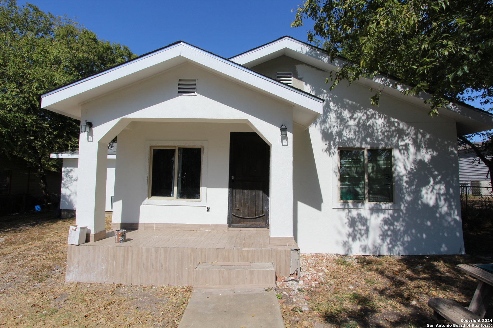 a front view of a house with a garage