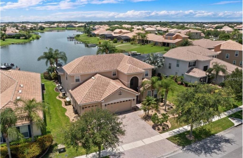 an aerial view of a house with a lake view