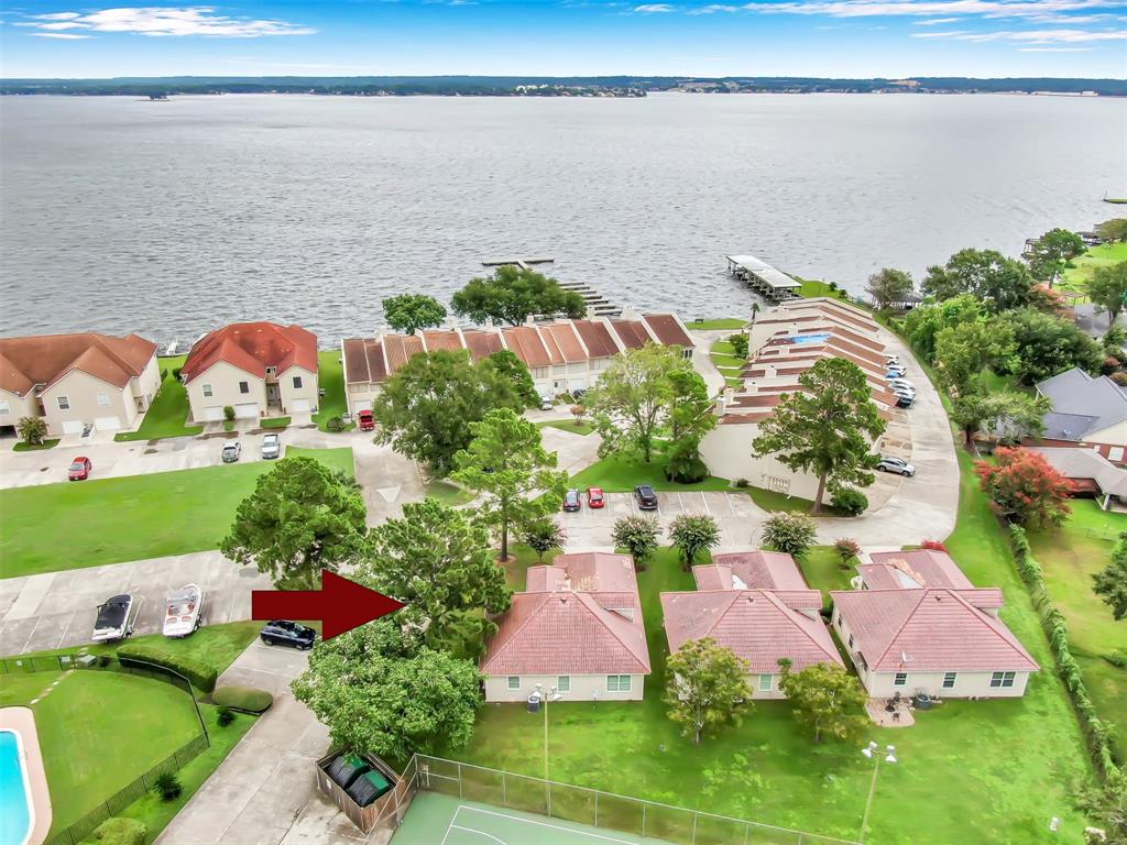 an aerial view of house with yard swimming pool and outdoor seating