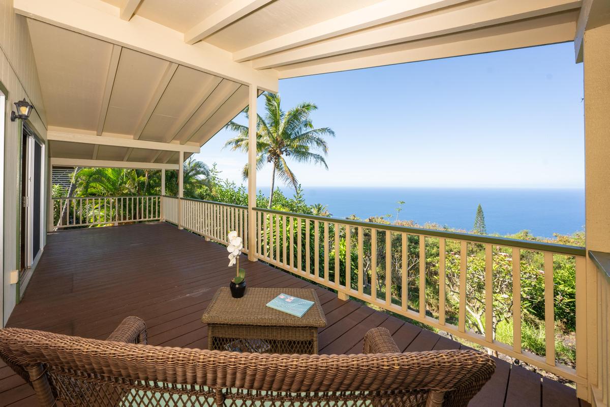 a view of balcony with wooden floor