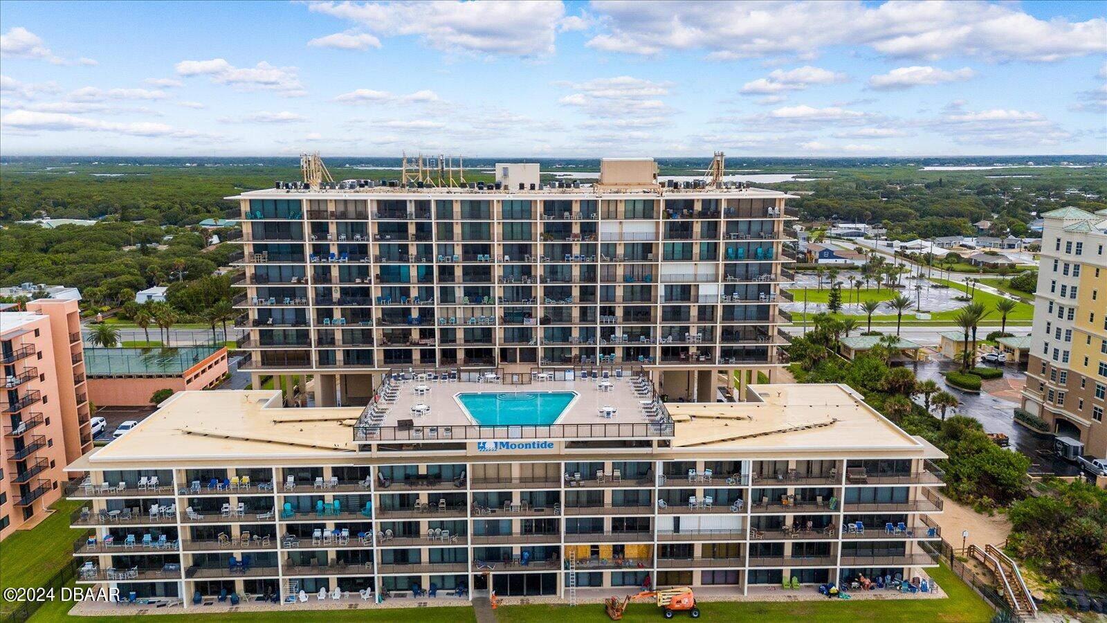 a view of a tall building with a city view