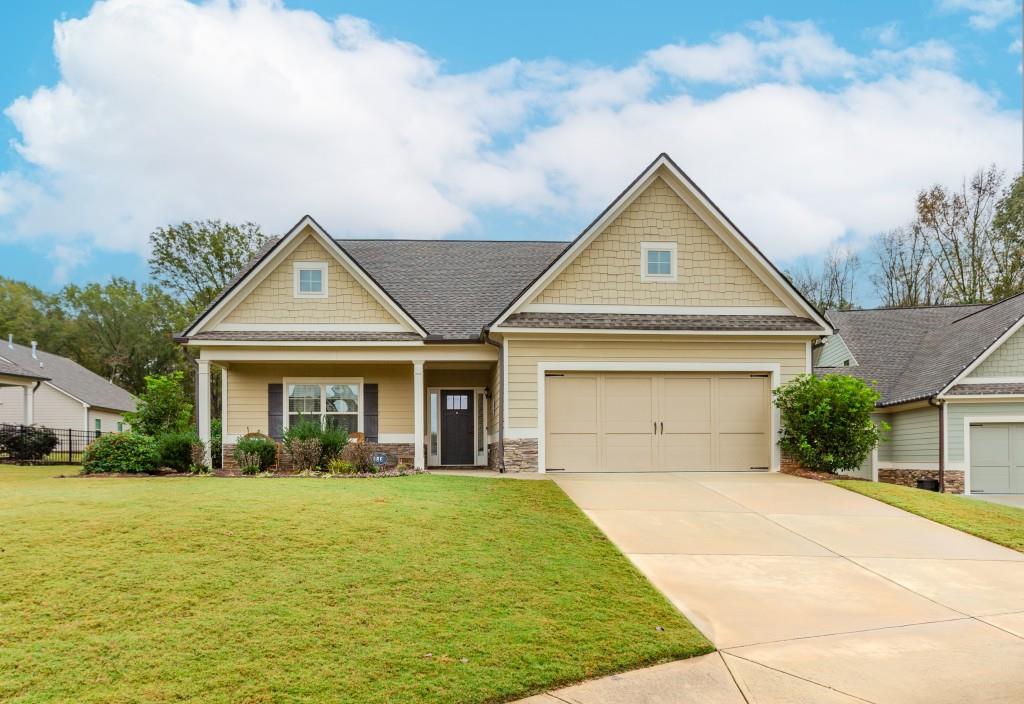 a front view of a house with yard