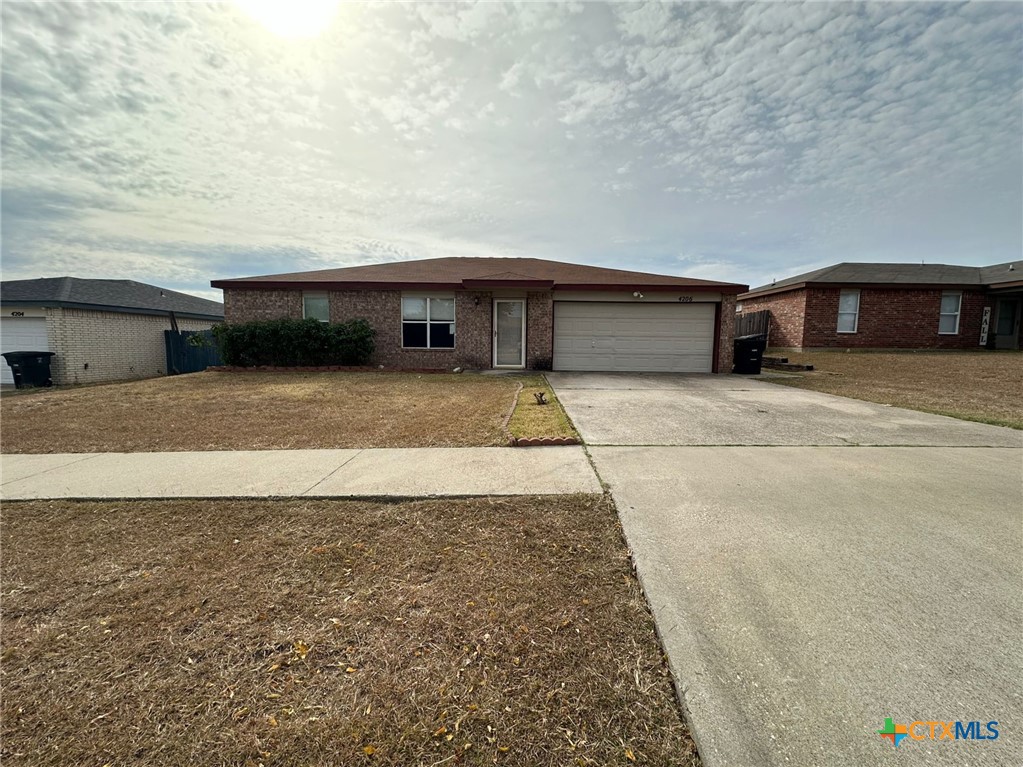 a view of house with yard