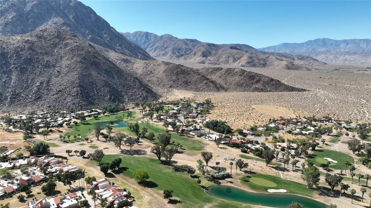 a view of a city with mountains in the background