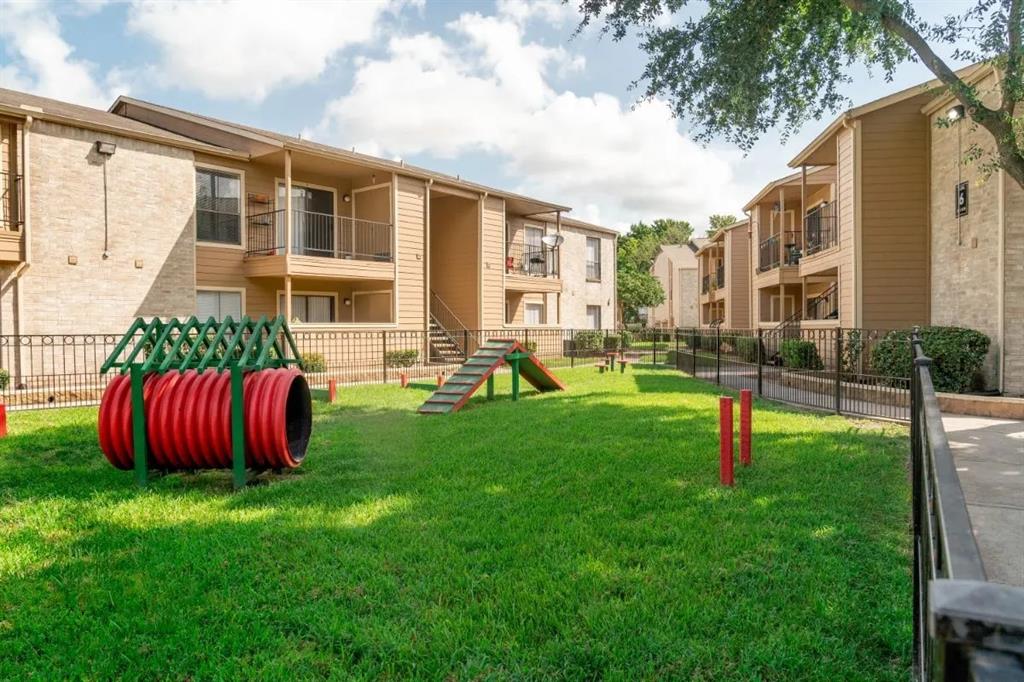 a view of backyard of the house with outdoor seating