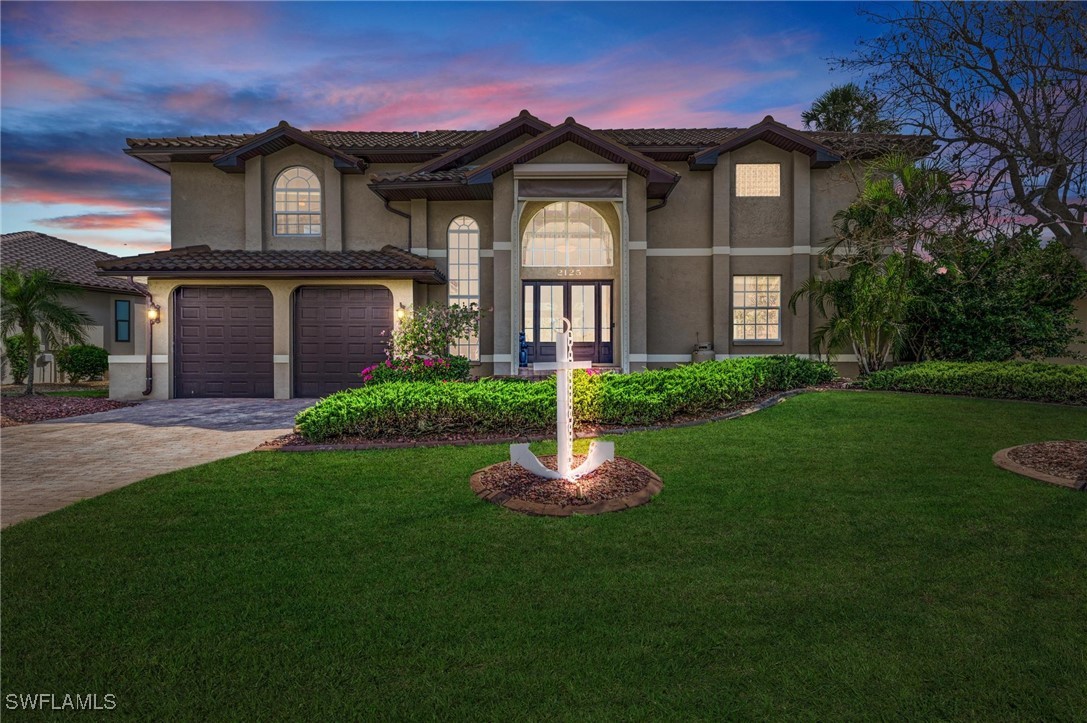 a front view of a house with a yard