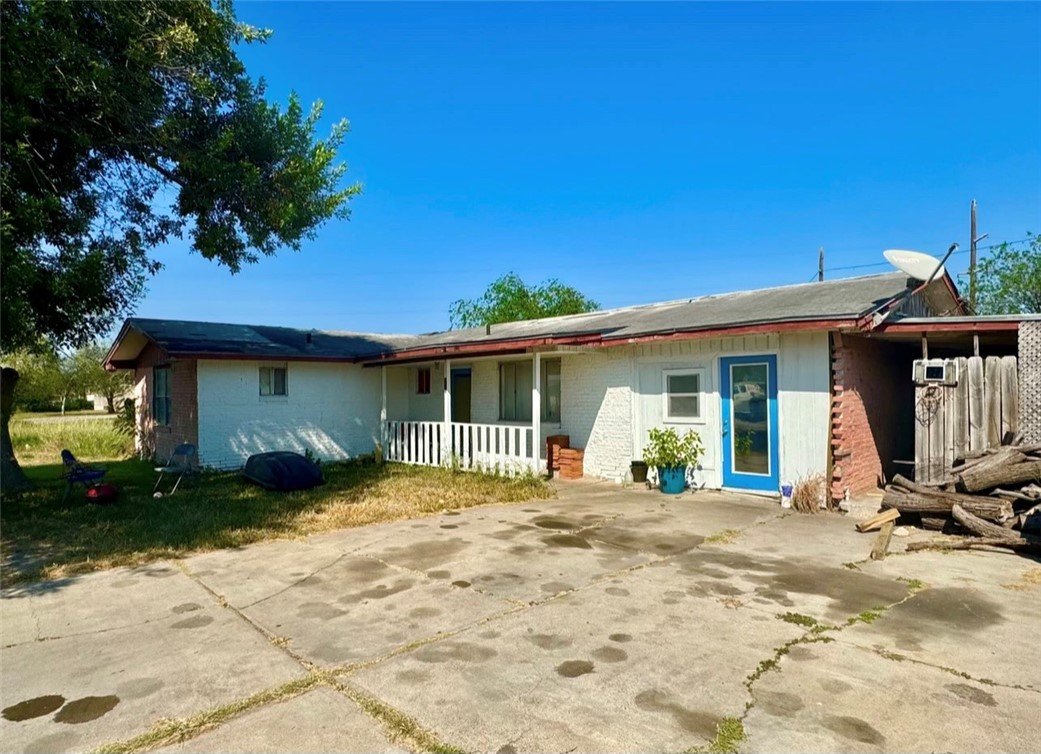 a front view of a house with a patio