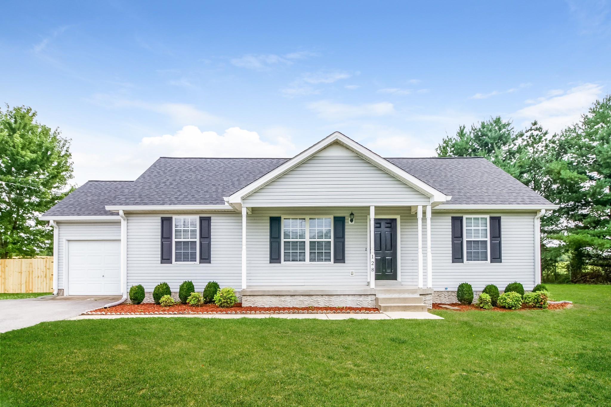 front view of a house with a yard