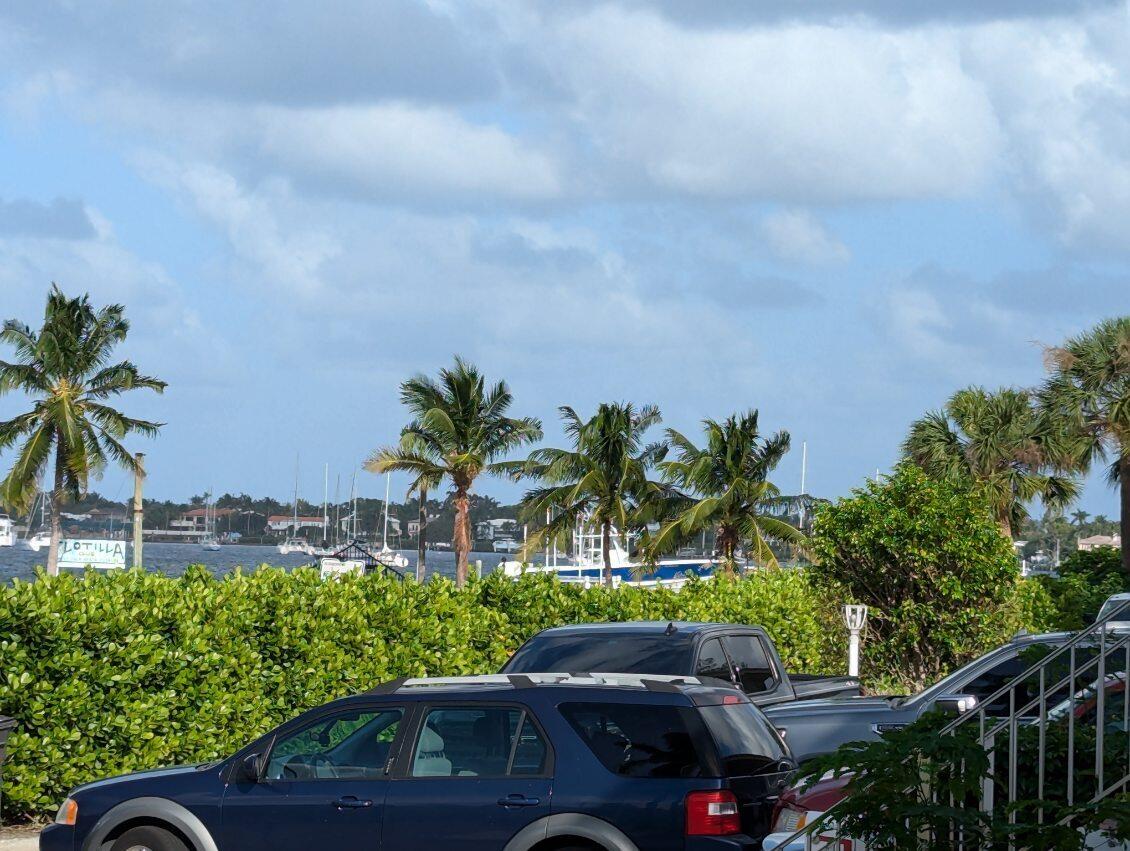 a couple of cars parked in front of a yard