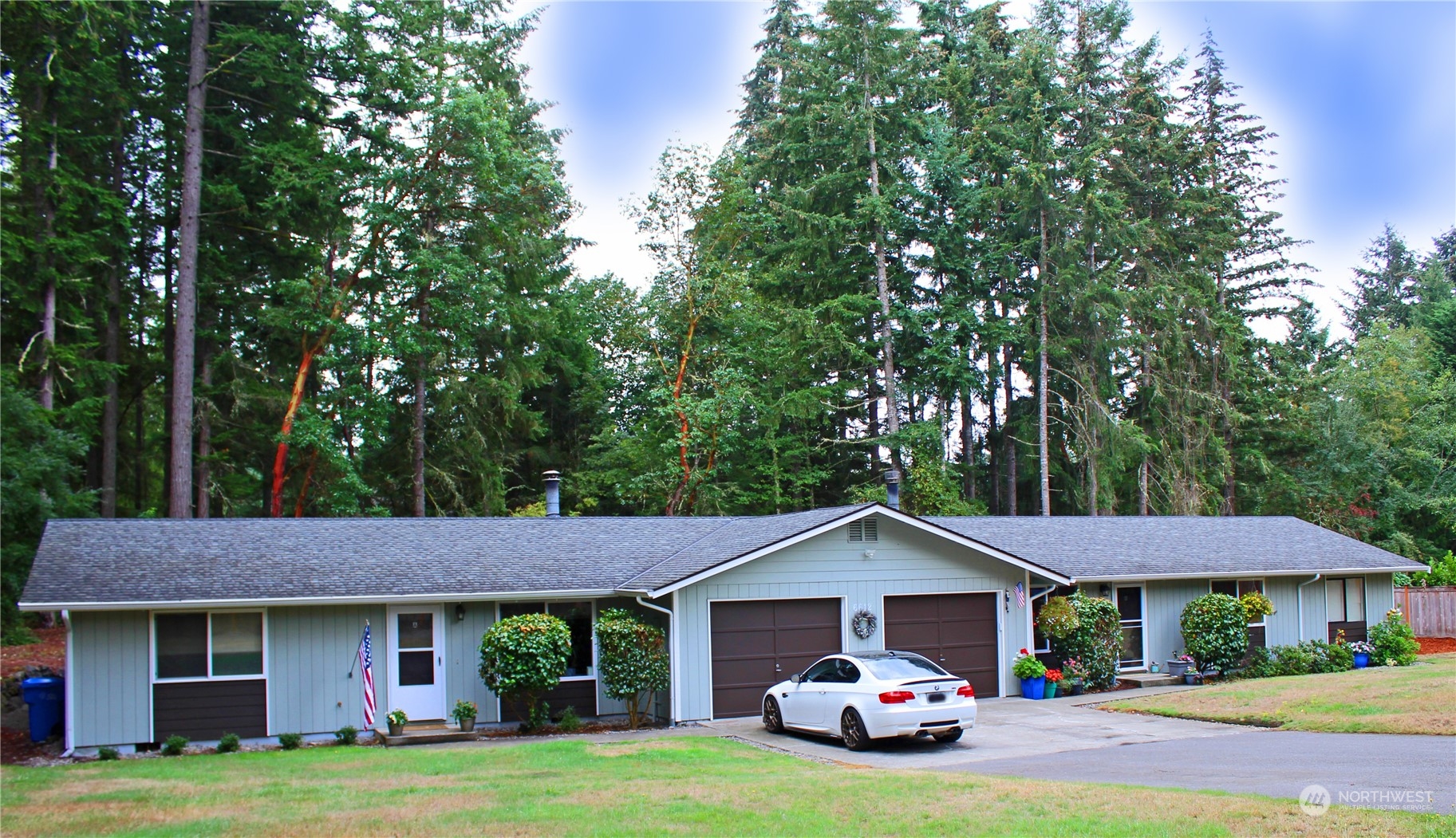 a front view of a house with a garden