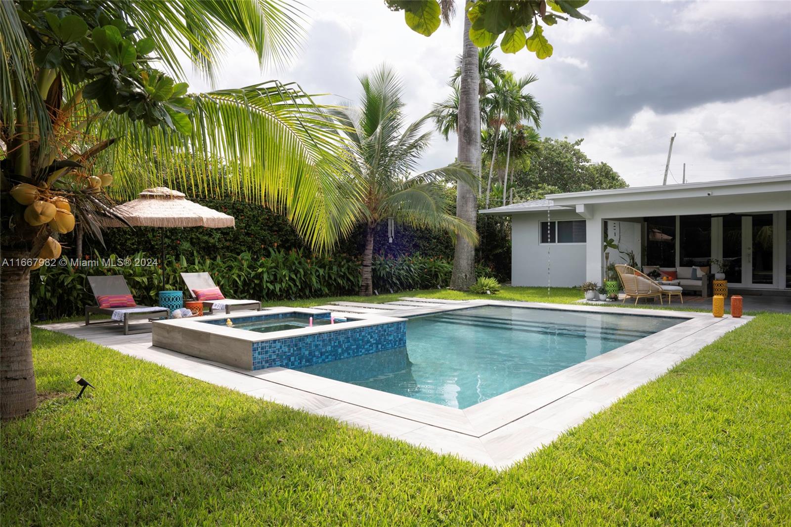 a view of a patio with swimming pool table and chairs