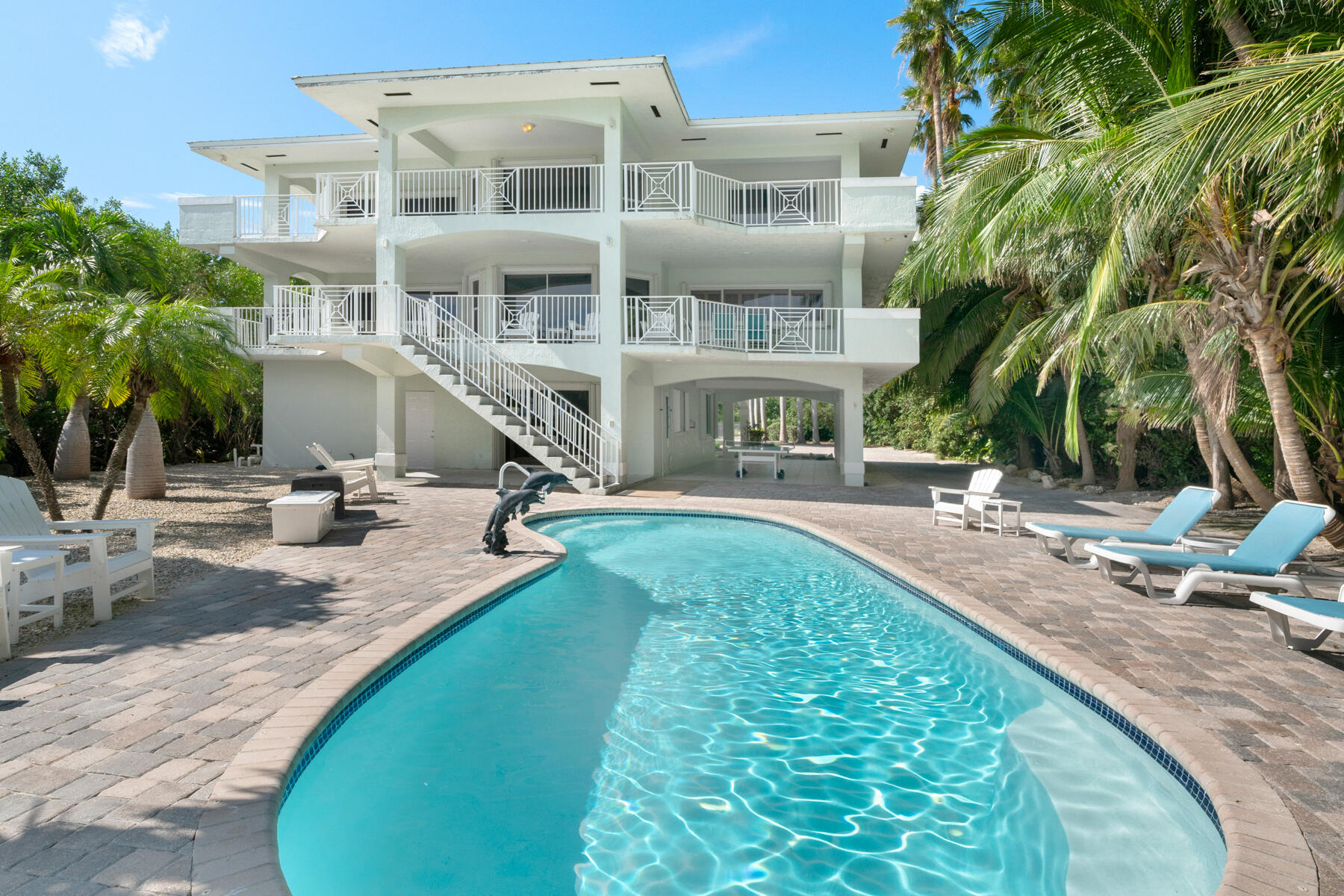 a view of a swimming pool with a lounge chairs