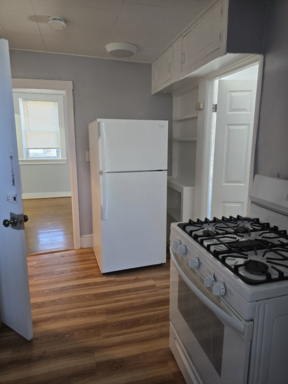 a kitchen with a stove and a refrigerator