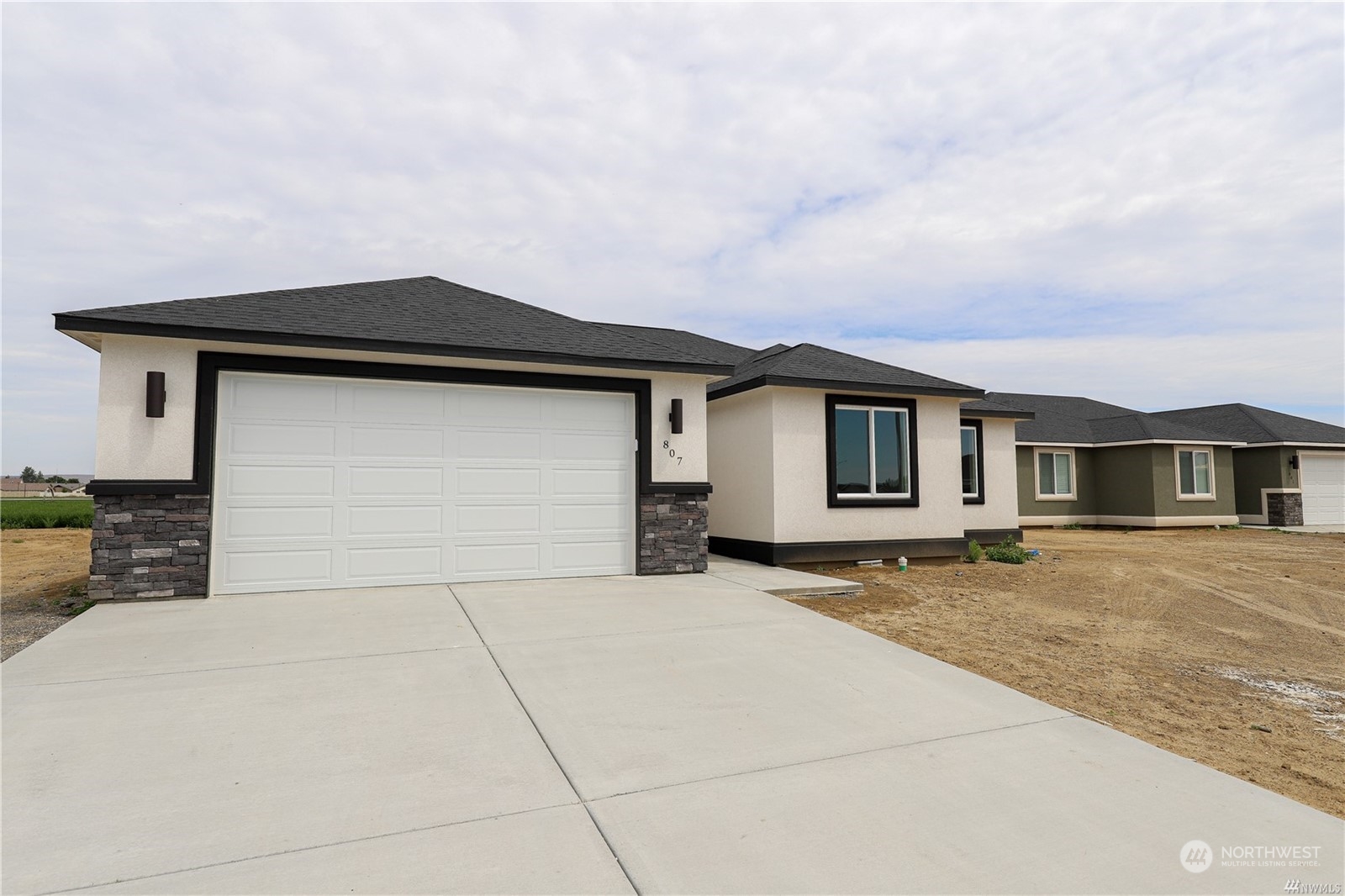 a front view of a house with yard