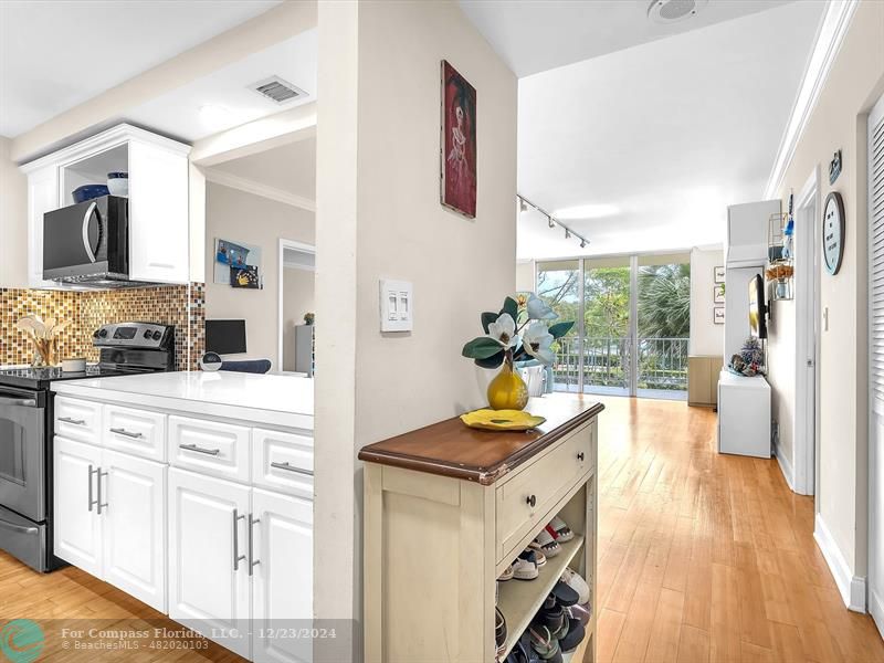 a view of living room with granite countertop furniture and a wooden floor