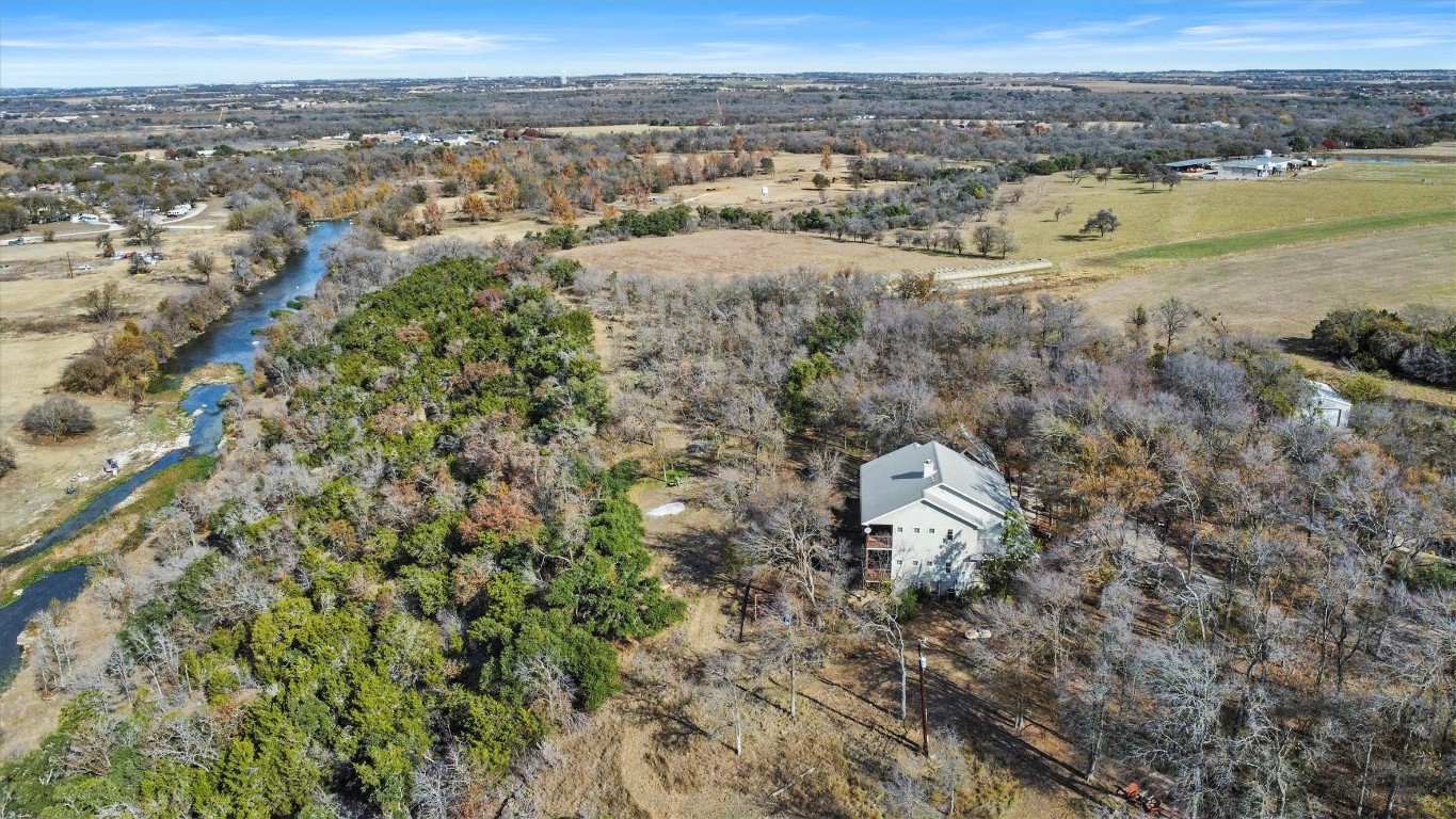 an aerial view of a house with a outdoor space