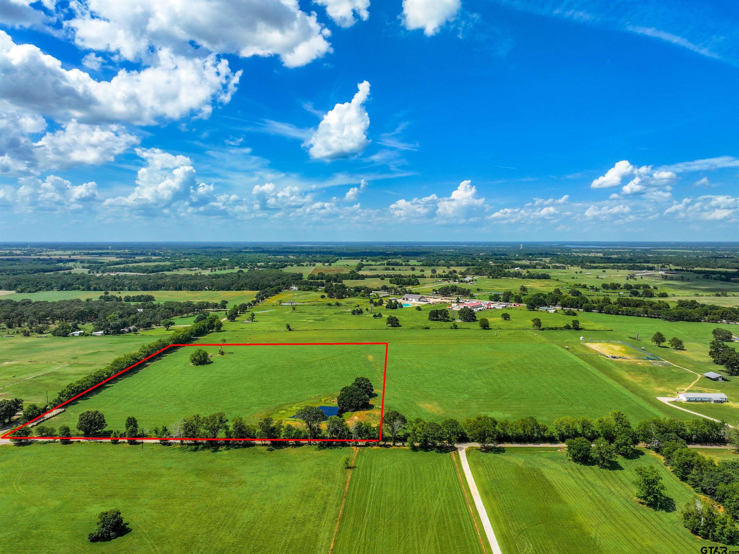 a view of a golf course with a big yard