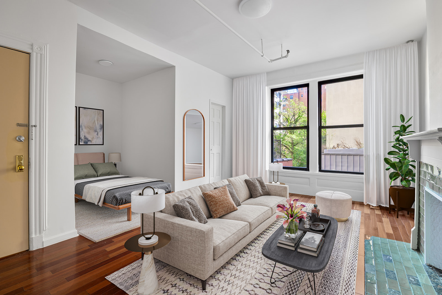 a living room with furniture and wooden floor