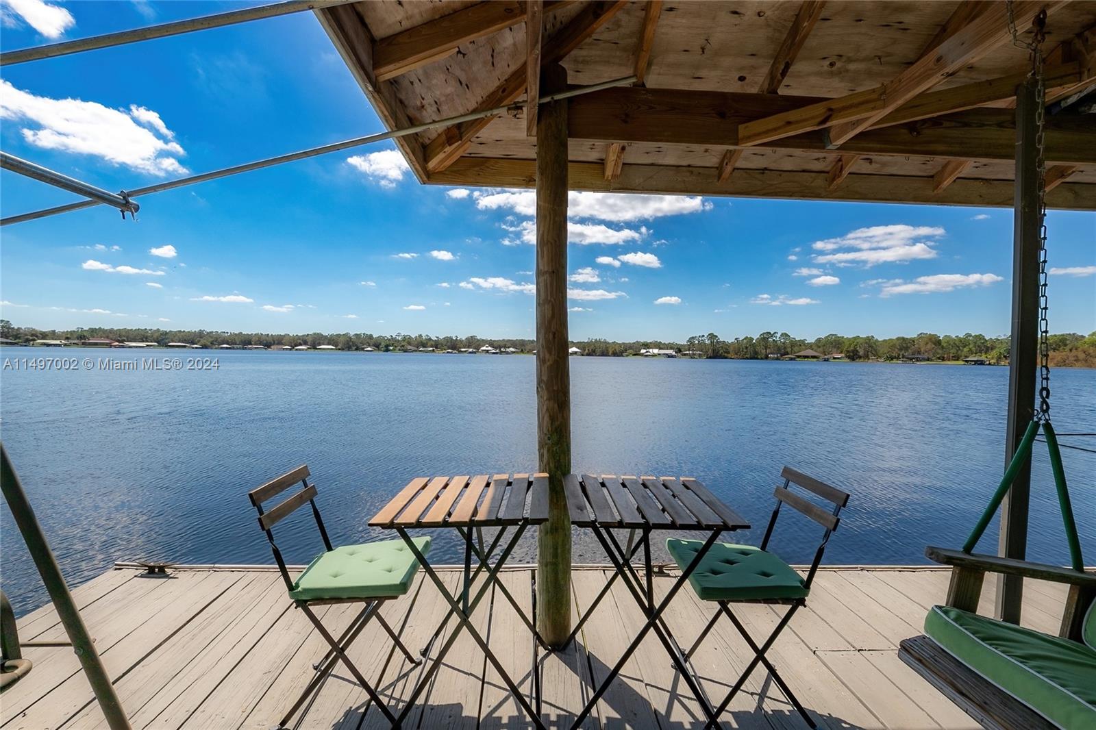 a view of a balcony with table and chairs