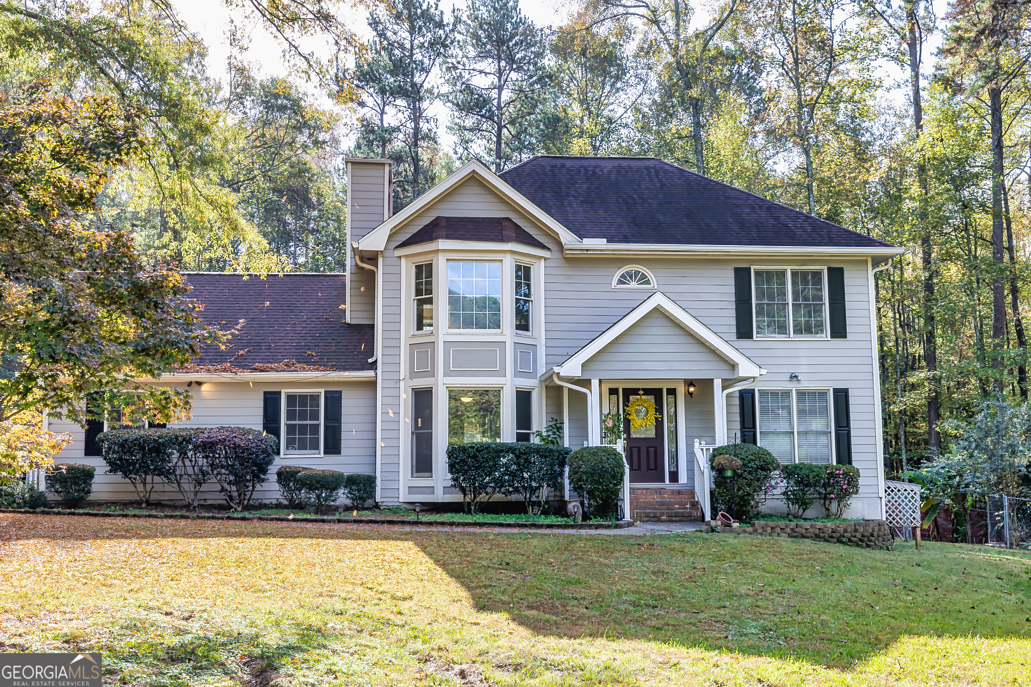 a front view of a house with a yard