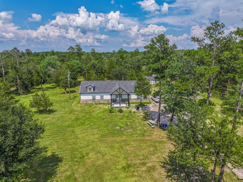 an aerial view of a house with a garden