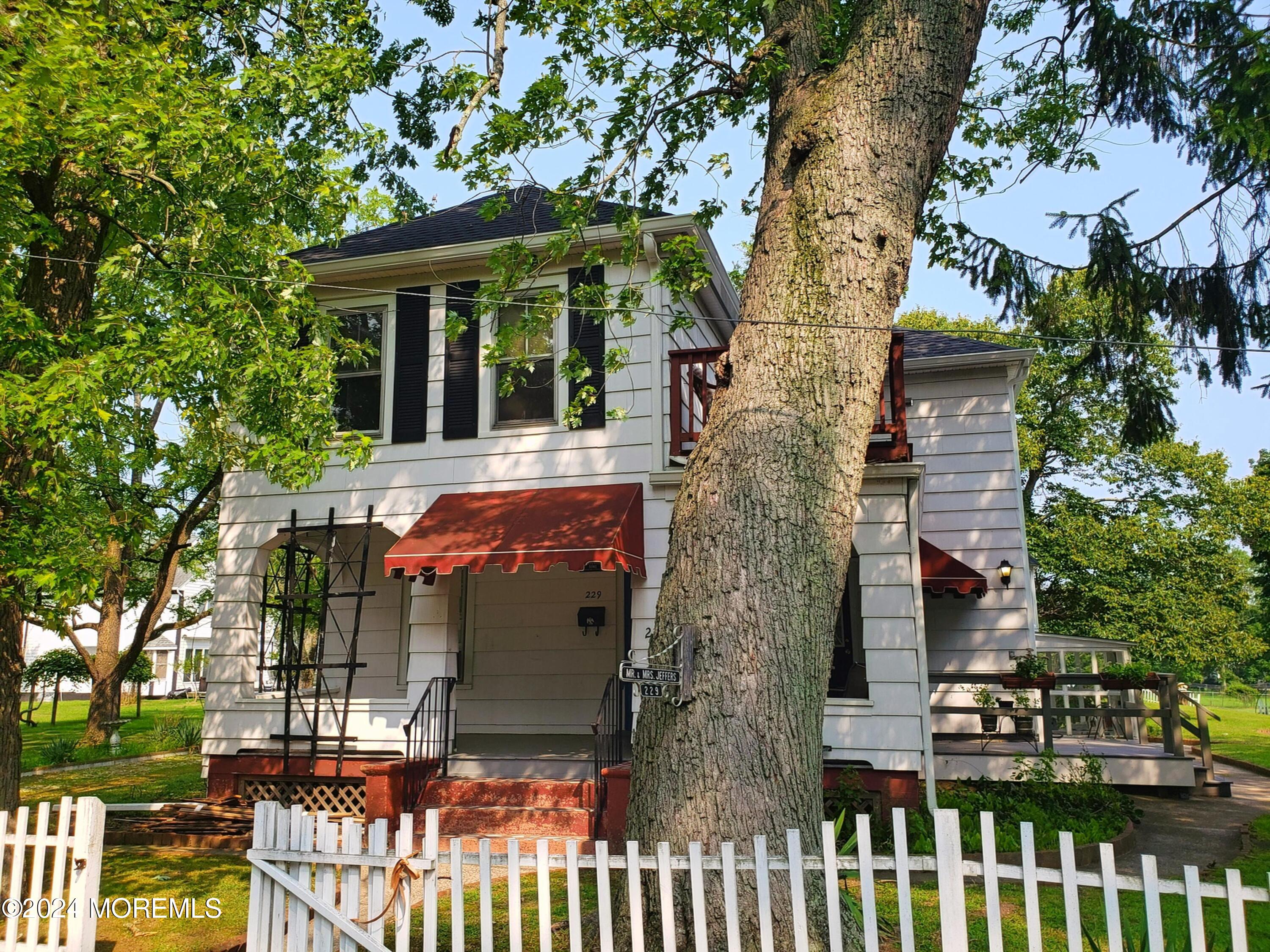 front view of house with a small yard