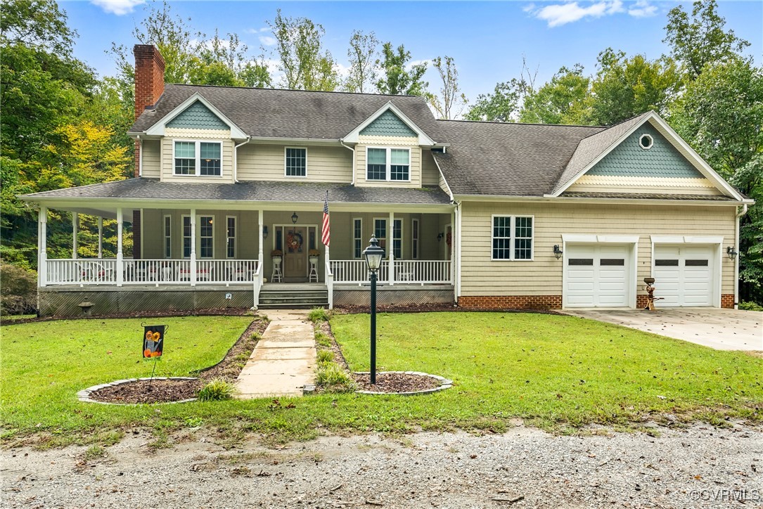 a view of a house with a yard patio and swimming pool